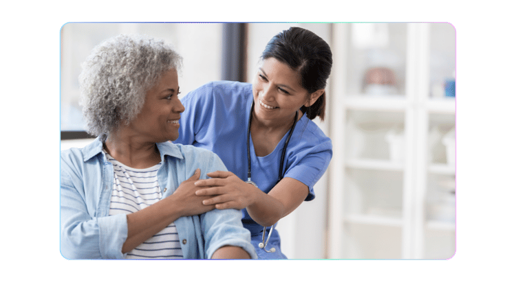 Carer smiling with a service user - OneTouch Essentials Landing Page